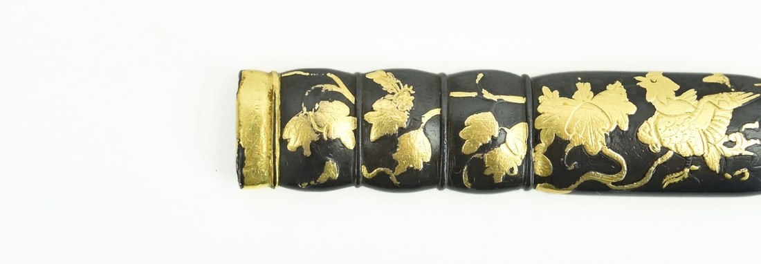 KINKO KODZUKA: Kinko Kodzuka Description: Kinko Kodzuka. Kaga School. Edo period (19th Century). Shakudo Migakiji lobed and decorated with a Phoenix in Paulownia and gold Hirozogan. Unsigned. Size: Length: 9.7