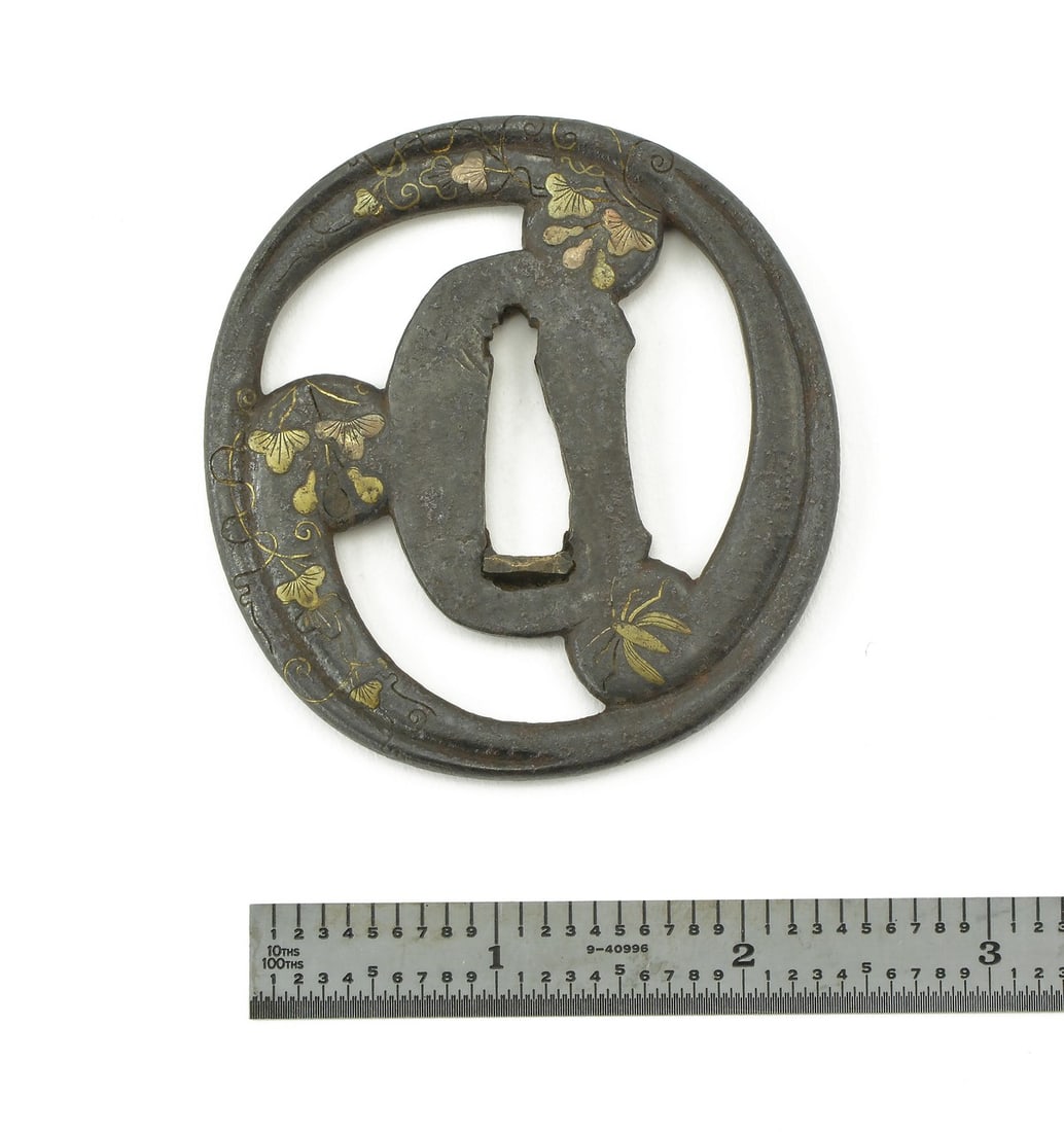 DAI-SHO TSUBA: Dai-Sho Tsuba Description: Dai-Sho Tsuba. Iron with floral inlay of brass and silver. Dai vertical measurement is 3” (7.8cm.). Sho is 2 ¾” (7cm.) Size: Length 2.3 inch 