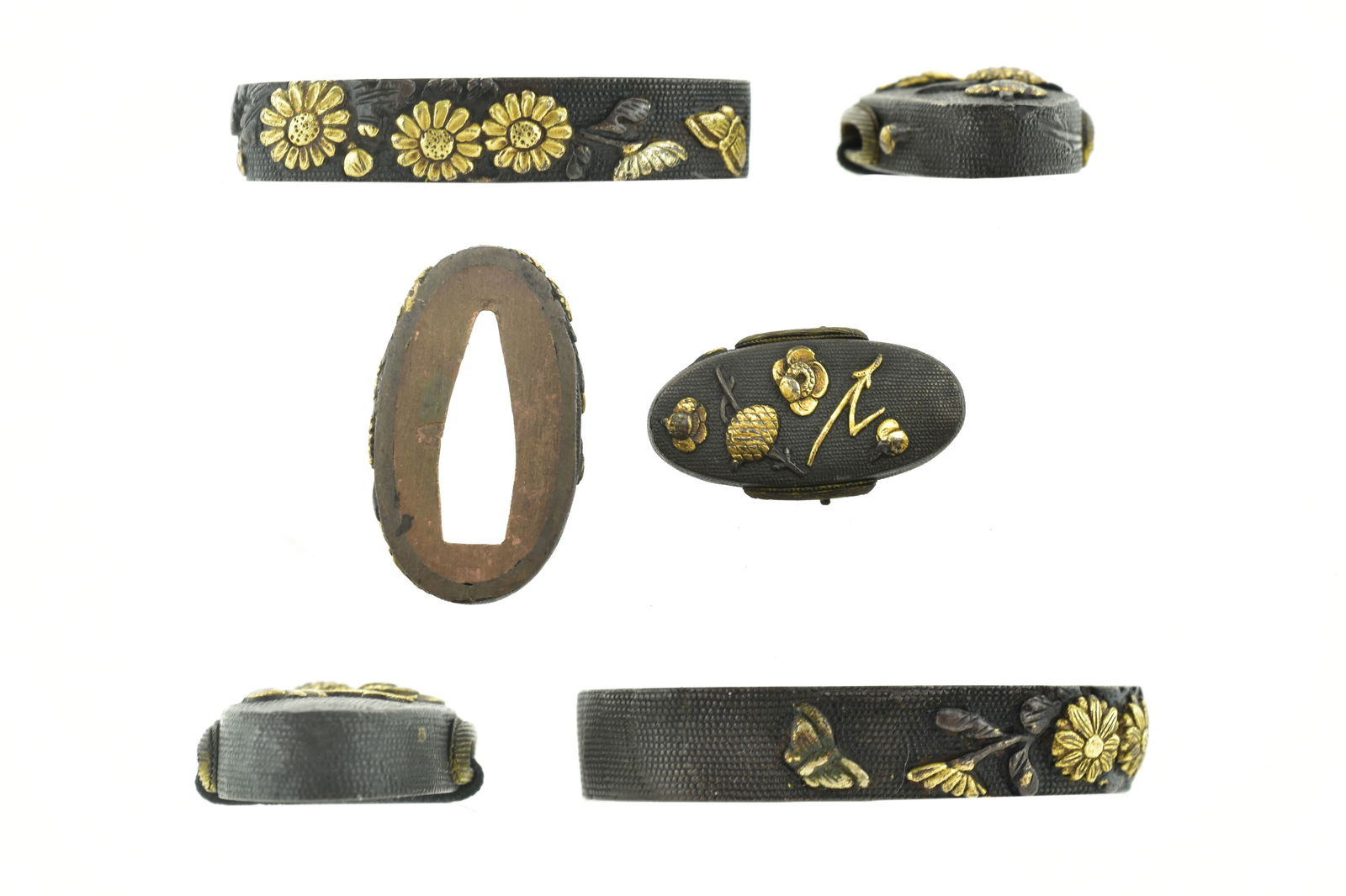 KINKO FUCHI KASHIRA: Kinko Fuchi Kashira Description: Kinko Fuchi Kashira. Shakudo Nanako ground. Floral pattern with gold and silver highlights, unsigned. Size: None Accessories: None Accessories Notice: When purchasin