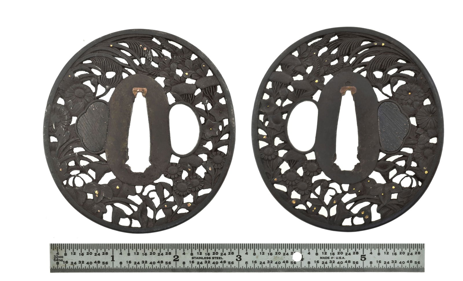 DAISHO IRON SUKASHI TSUBA: Daisho Iron Sukashi Tsuba Description: Das-sho Iron Tsuba Sukashi. Elaborately carved floral theme with gold highlights. Dai (Large diameter) 3” and Sho (small diameter) 2?”. Size: