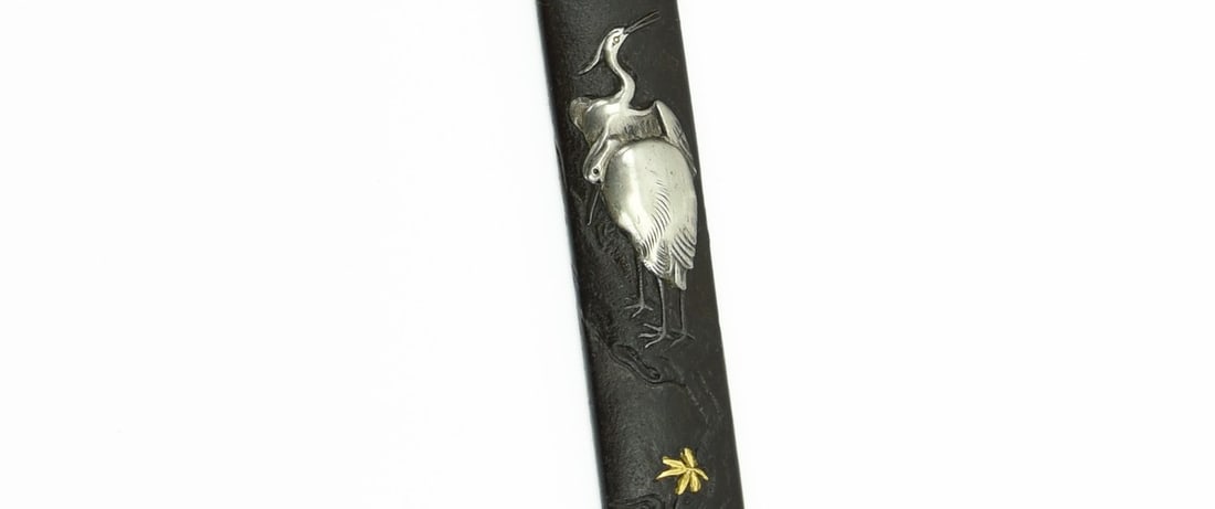 IRON KODZUKA: Iron Kodzuka ( Description: Iron Kodzuka. Two silver cranes standing on rocky outcrop under a weeping willow gold foliage at base. Signed. Size: Length 3. 75 inch Accessories: None Accessories