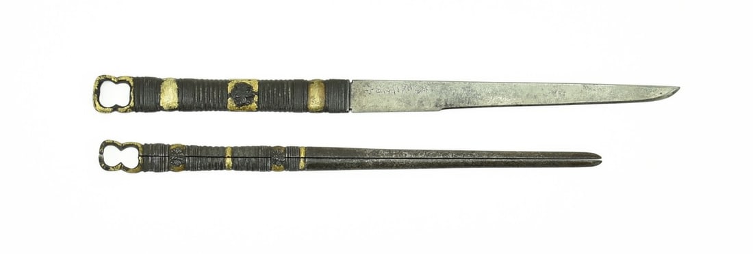 WARIBASHI, KODZUKA AND KO-GATANA SET: Waribashi, Kodzuka and Ko-gatana set Description: Kodzuka and Waribashi Iron Mon Surrounded by gold bands. Ko-gatana signed. Scarce pair particularly in iron. Size: None Accessories: None