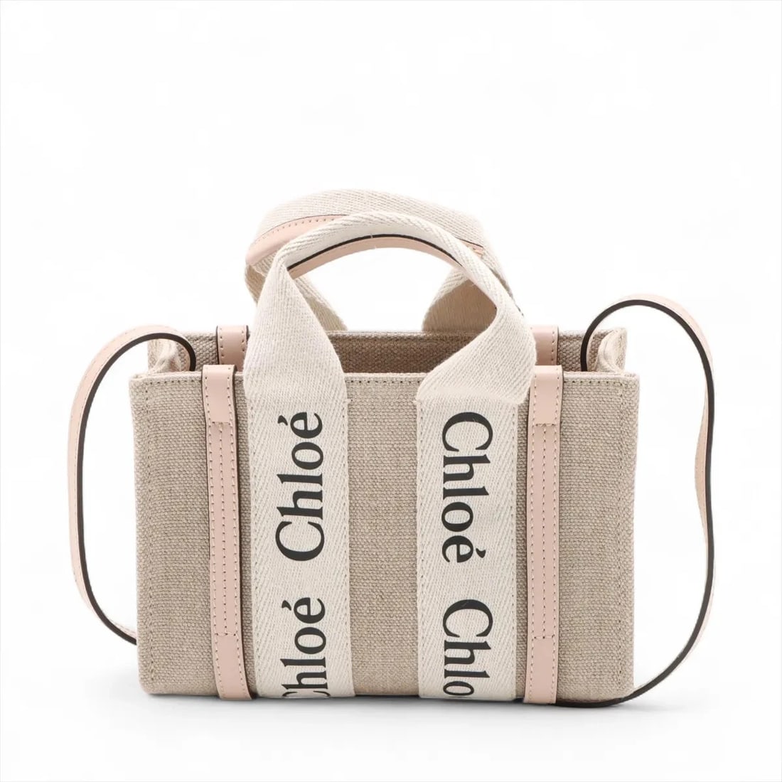 CHLOE WOODY MINI CANVAS X LEATHER 2 WAY HANDBAG: Chloe woody Mini canvas x leather 2 Way Handbag Brand: Chloe Type: Hand bag Material: canvas Color: Beige Size: Height:5.5inch Length:7.9inch Depth:2.6inch Handle height:2.8inch Accessories: None