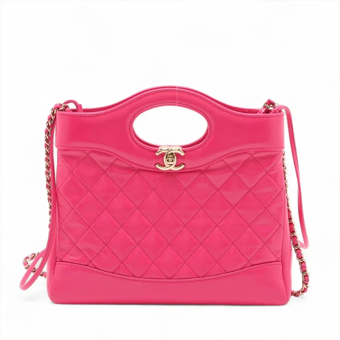 CHANEL 31 SHINY CALFSKIN 2 WAY HANDBAG: Chanel 31 shiny calfskin 2 Way Handbag Brand: Chanel Type: Hand bag Material: shiny calfskin Color: Pink Size: Height:8.9inch Length:9.1inch Depth:1.8inch Handle height:1.8inch Accessories: None