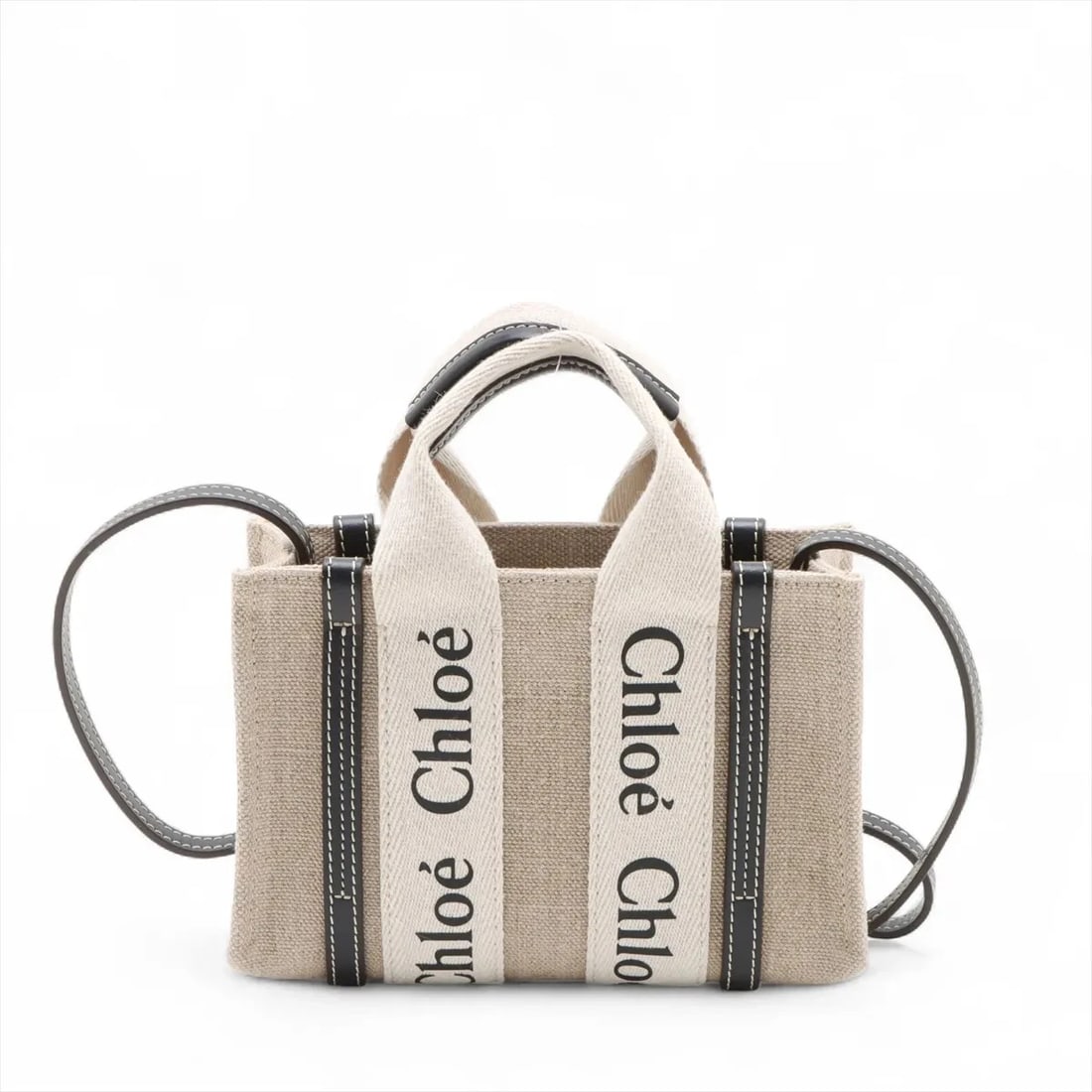 CHLOE WOODY MINI CANVAS X LEATHER 2 WAY HANDBAG: Chloe woody Mini canvas x leather 2 Way Handbag Brand: Chloe Type: Hand bag Material: canvas Color: Beige Size: Height:5.3inch Length:7.9inch Depth:2.6inch Handle height:3.0inch Shoulder height:20