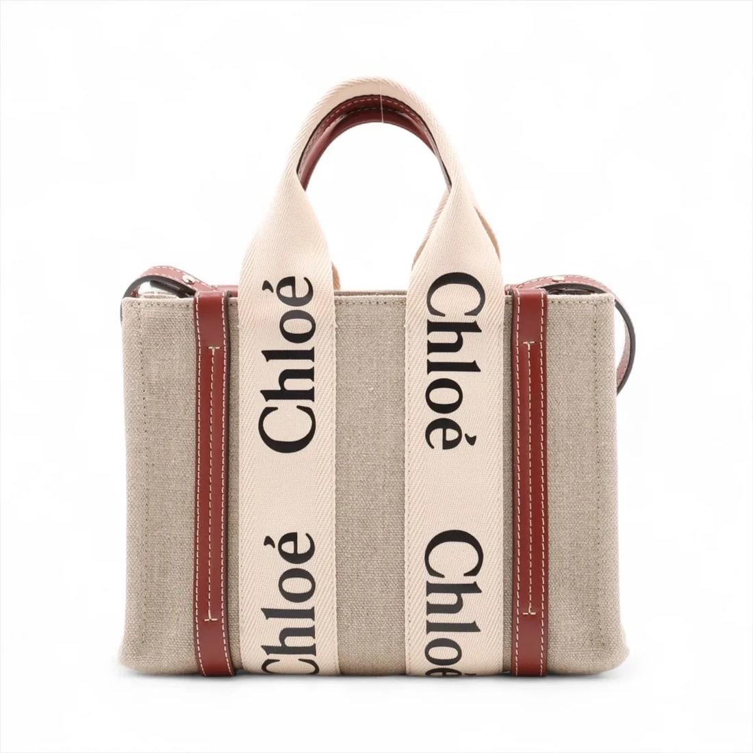 CHLOE WOODY SMALL CANVAS X LEATHER 2 WAY HANDBAG: Chloe woody Small canvas x leather 2 Way Handbag Brand: Chloe Type: Hand bag Material: canvas Color: Beige Size: Height:7.7inch Length:10.2inch Depth:3.3inch Handle height:4.3inch Shoulder height:
