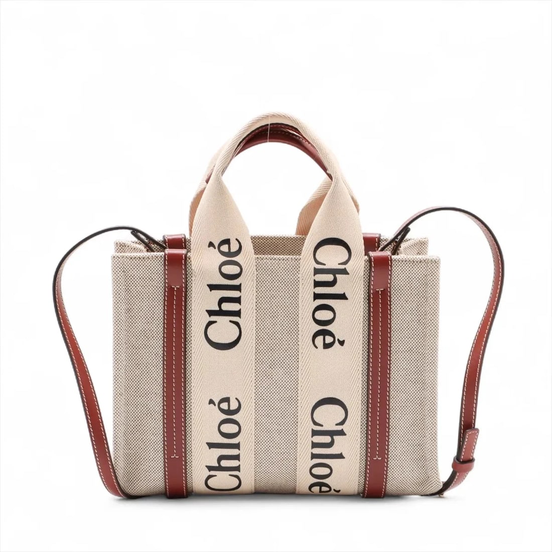 CHLOE WOODY SMALL CANVAS X LEATHER 2 WAY HANDBAG: Chloe woody Small canvas x leather 2 Way Handbag Brand: Chloe Type: Hand bag Material: canvas Color: Beige Size: Height:8.1inch Length:10.4inch Depth:3.3inch Handle height:4.3inch Shoulder height: