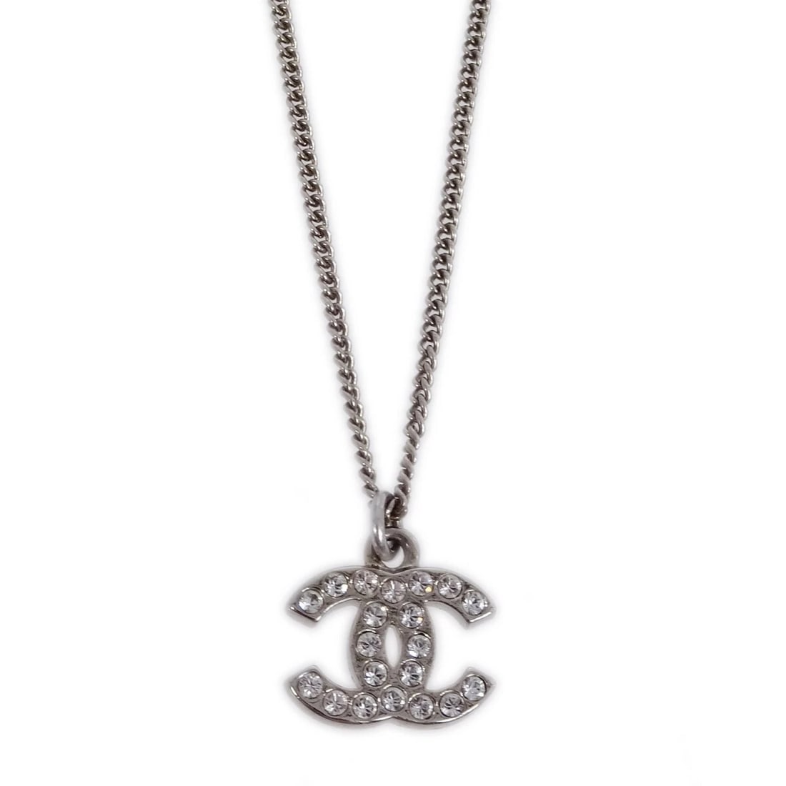 CHANEL SILVER CHAIN NECKLACE PENDANT RHINESTONE: Chanel Silver Chain Necklace Pendant Rhinestone Brand: CHANEL Type: Pendant Material: Silver Plated Rhinestone Color: Silver Size: Chain(Overall) : 43.5 cm Charm : W 1.4 × H 1.0 cm 