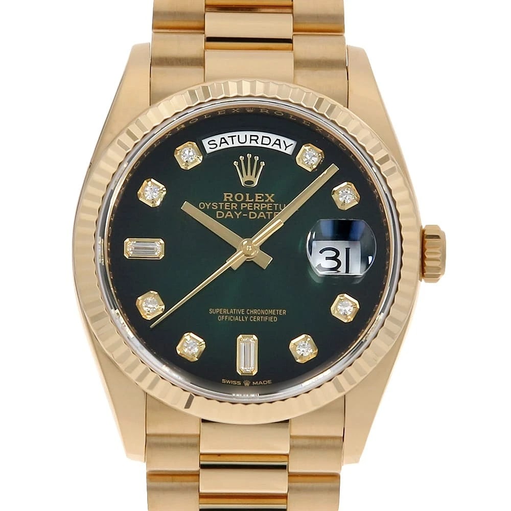 ROLEX DAY DATE 36 8P ROUND 2P BAGUETTE DIAMOND WATCH: ROLEX Day Date 36 8P Round 2P Baguette Diamond Watch Brand: ROLEX Type: Wrist watch Material: Band Material Yellow Gold, Case Material Yellow Gold Color: Dial Color Green Ombre Size: Band Size 19c