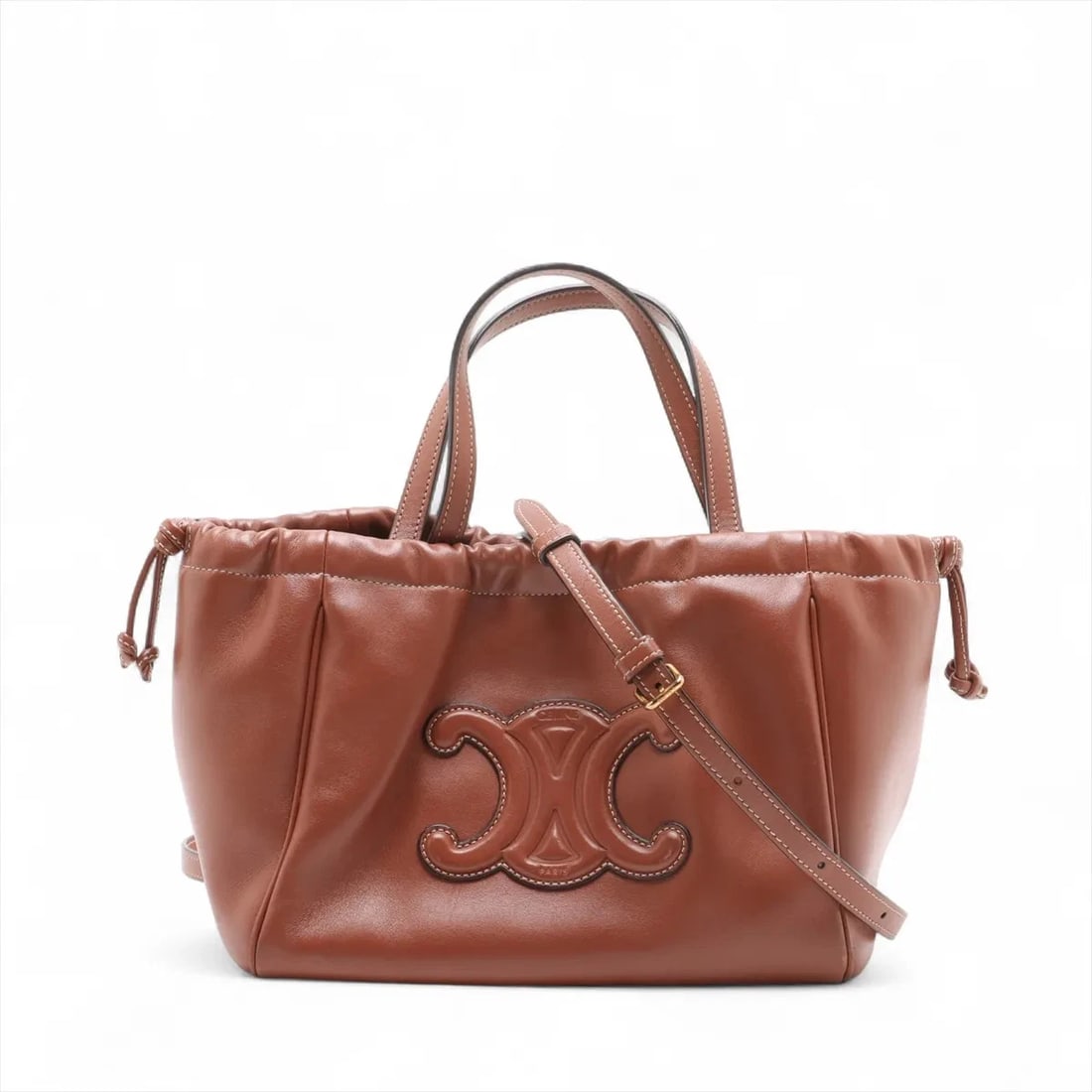 CELINE SMALL CABAS DRAWSTRING CUIR TRIOMPHE LEATHER 2 WAY HANDBAG: Celine Small Cabas Drawstring Cuir Triomphe Leather 2 Way Handbag Brand: Celine Type: Hand bag Material: Leather Color: Brown Size: Height:6.7inch Length:8.9inch Depth:5.1inch Handle height:4.9inc