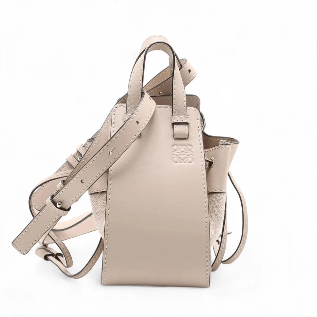 LOEWE HAMMOCK DRAWSTRING MINI CANVAS X LEATHER 2 WAY HANDBAG: Loewe Hammock Drawstring mini canvas x leather 2 Way Handbag Brand: Loewe Type: Hand bag Material: canvas Color: Beige Size: Height:7.1inch Length:3.9inch Depth:2.8inch Handle height:2.4inch Shoul