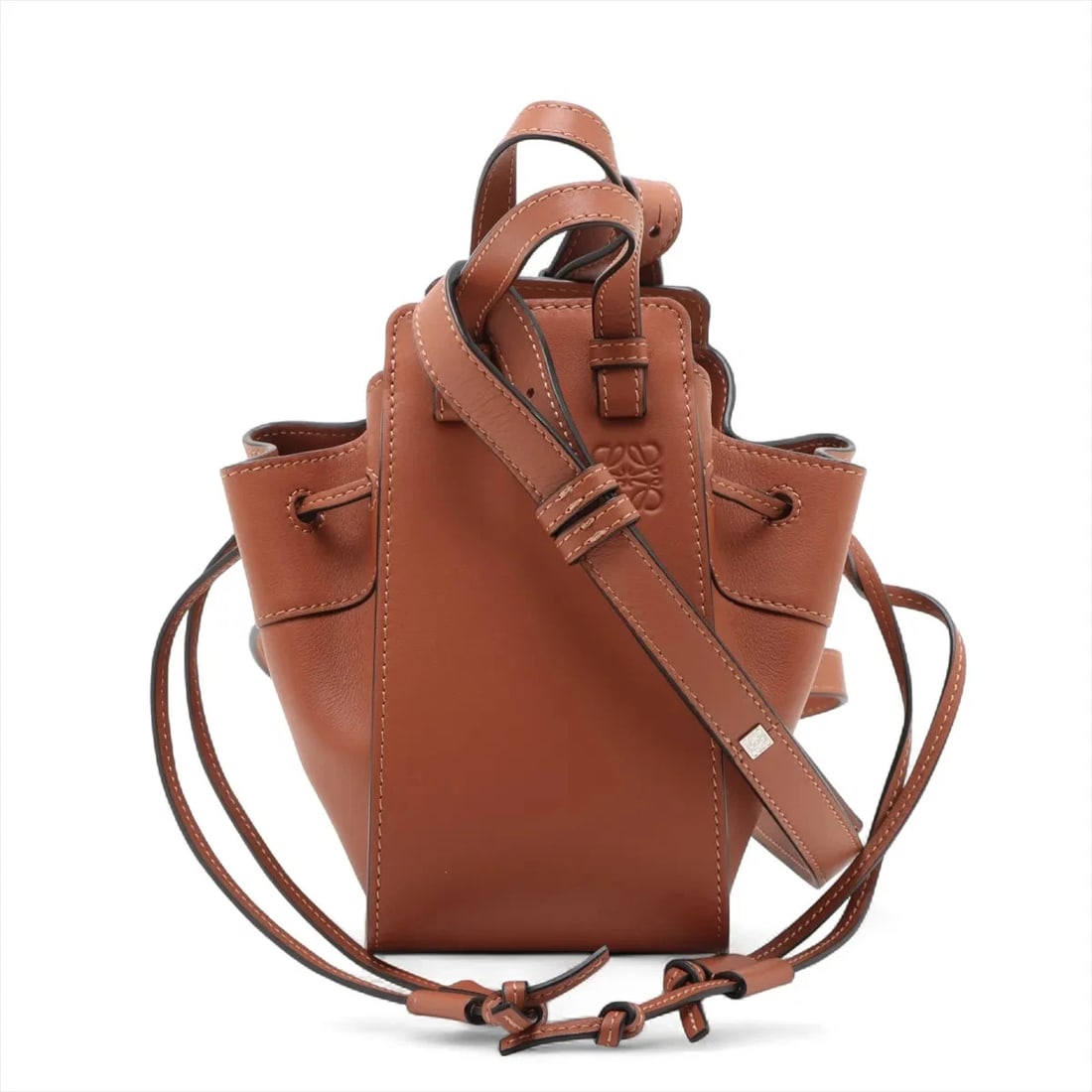 LOEWE HAMMOCK DRAWSTRING MINI LEATHER 2 WAY HANDBAG: Loewe Hammock Drawstring mini Leather 2 Way Handbag Brand: Loewe Type: Hand bag Material: Leather Color: Brown Size: Height:7.7inch Length:4.1inch Depth:6.7inch Handle height:2.6inch Shoulder heig