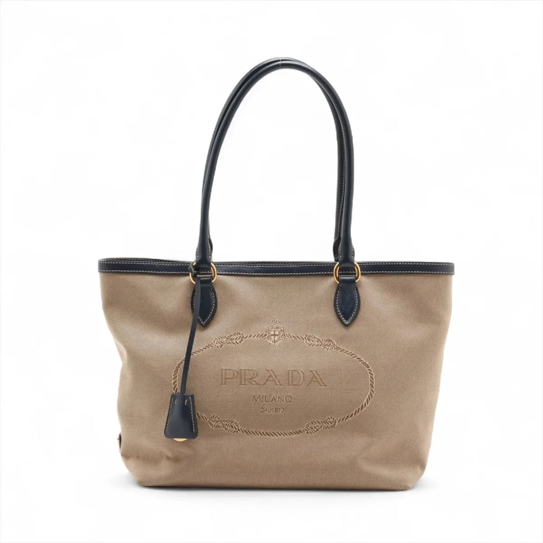 PRADA LOGO JACQUARD CANVAS X LEATHER TOTE BAG: Prada Logo Jacquard canvas x leather Tote bag Brand: Prada Type: Tote bag Material: canvas Color: Beige Size: Height:9.3inch Length:10.8inch Handle height:8.1inch Accessories: None Accesso