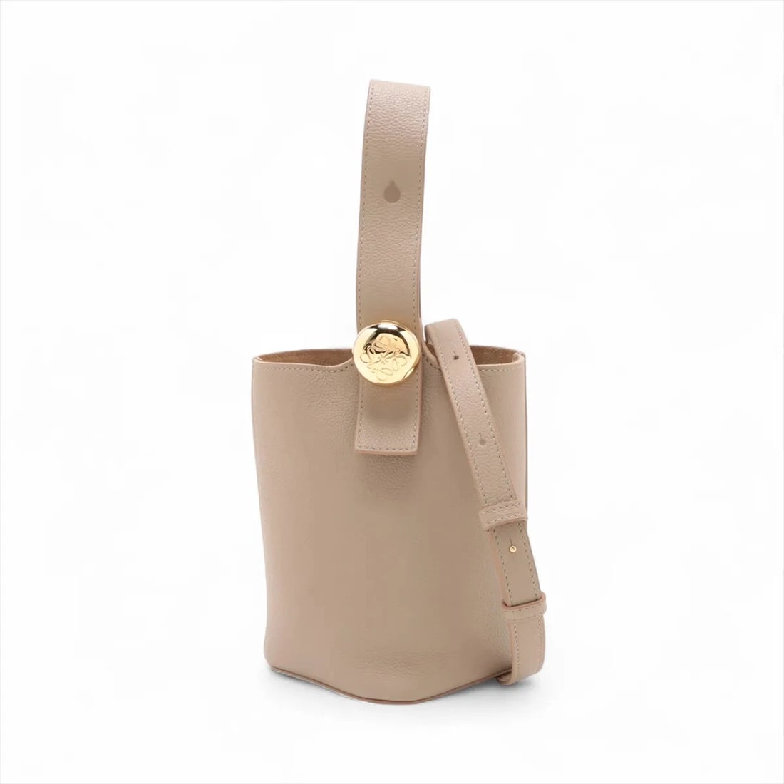 LOEWE PEBBLE BUCKET BAG MINI LEATHER 2 WAY HANDBAG: Loewe Pebble bucket bag Mini Leather 2 Way Handbag Brand: Loewe Type: Hand bag Material: Leather Color: Beige Size: Height:7.5inch Length:6.3inch Depth:6.1inch Handle height:6.1inch Shoulder