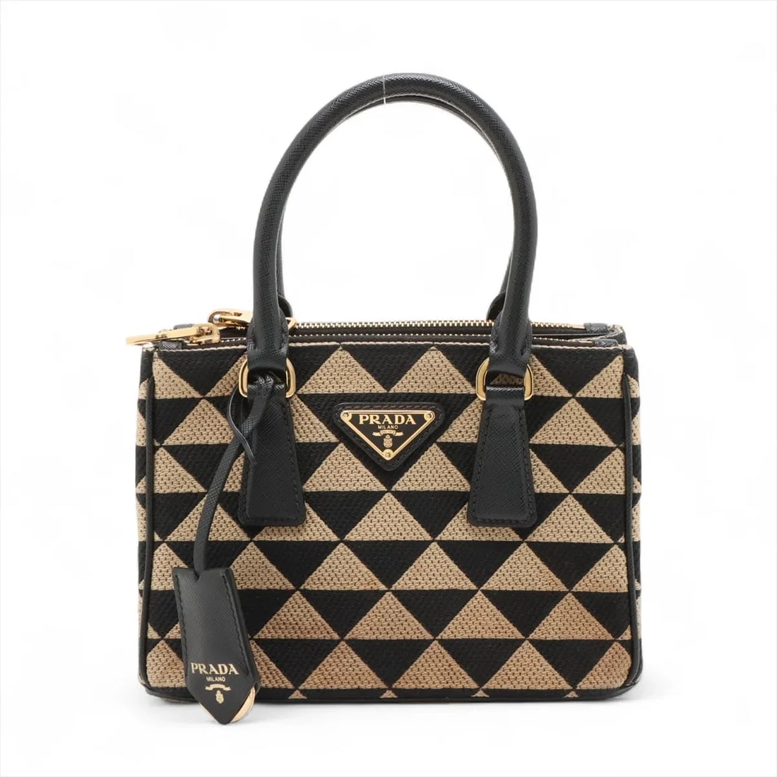 PRADA EMBROIDERY SYMBOL CANVAS X LEATHER HAND BAG: Prada Embroidery Symbol canvas x leather Hand bag Brand: Prada Type: Hand bag Material: canvas Color: Beige Size: Height:5.7inch Length:8.1inch Depth:3.9inch Handle height:3.7inch Accessories: No