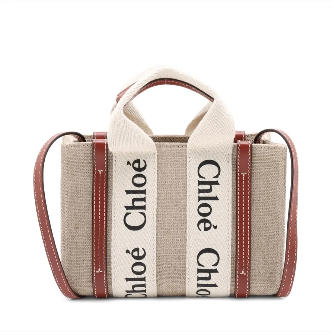 CHLOE WOODY MINI CANVAS X LEATHER 2 WAY HANDBAG: Chloe woody Mini canvas x leather 2 Way Handbag Brand: Chloe Type: Hand bag Material: canvas Color: Brown Size: Height:5.3inch Length:7.7inch Depth:3.0inch Handle height:3.0inch Shoulder height:20