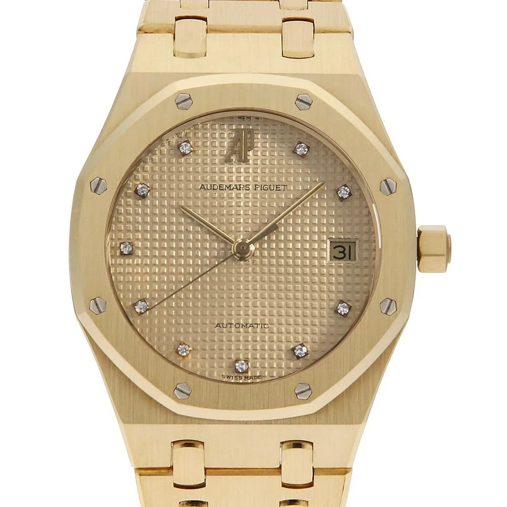 AUDEMARS PIGUET ROYAL OAK DIAMOND WATCH: AUDEMARS PIGUET Royal Oak Diamond Watch Brand: AUDEMARS PIGUET Type: Wrist watch Material: Band Material Yellow Gold, Case Material Yellow Gold Color: Dial Color Champagne Gold Size: Band Size