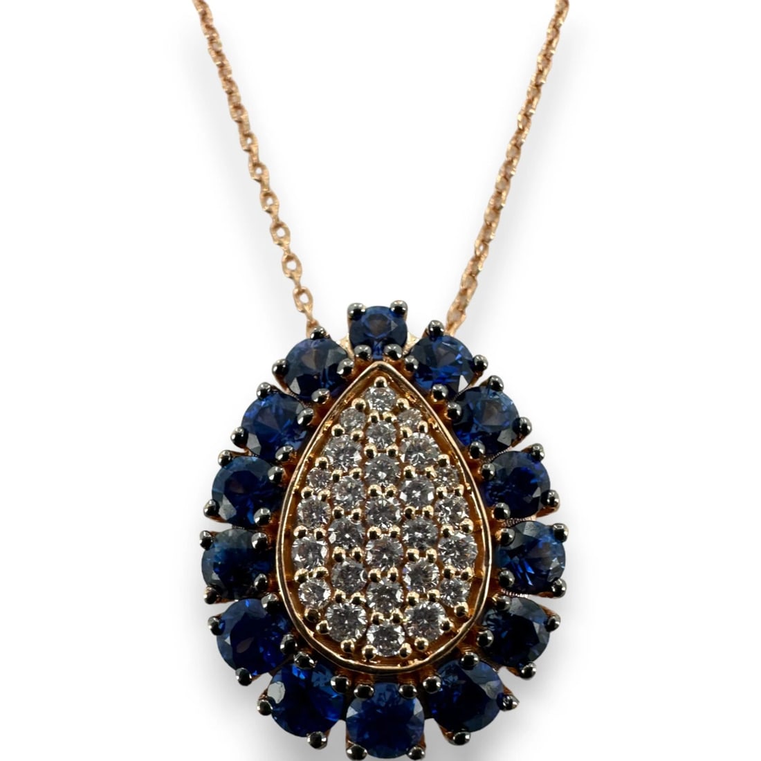 LEVIAN 14KT ROSE GOLD NECKLACE TEARDROP PENDANT DIAMONDS BLUE SAPPHIRES: LeVian 14kt Rose Gold Necklace Teardrop Pendant Diamonds Blue Sapphires Brand: LeVian Type: Necklace Material: Rose Gold 14k Main Stone/Creation Natural Color: Rose Size: Length of Chain - 18" Wid