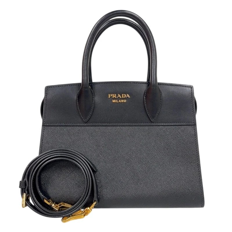 PRADA ESPLANADE HANDBAG HANDBAG: PRADA Esplanade Handbag Handbag Brand: PRADA Type: Handbag Material: Saffiano Calfskin Color: Black Gold Hardware Size: W10.0 x H7.9x D5.3inch Accessories: None Accessories Notice: When