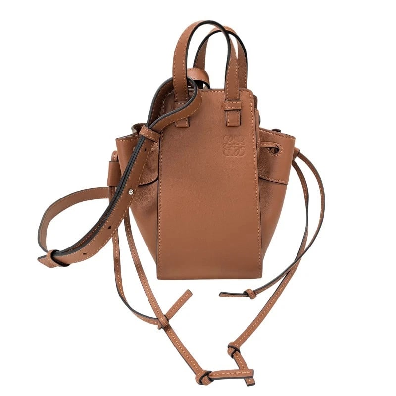 LOEWE HAMMOCK DRAWSTRING MINI SHOULDER BAG: LOEWE Hammock Drawstring Mini Shoulder Bag Brand: LOEWE Type: Shoulder Bag Material: Calfskin Color: Brown Size: W4.3 x H7.5x D5.9inch Shoulder:37.0inch Accessories: None Accessories Notic