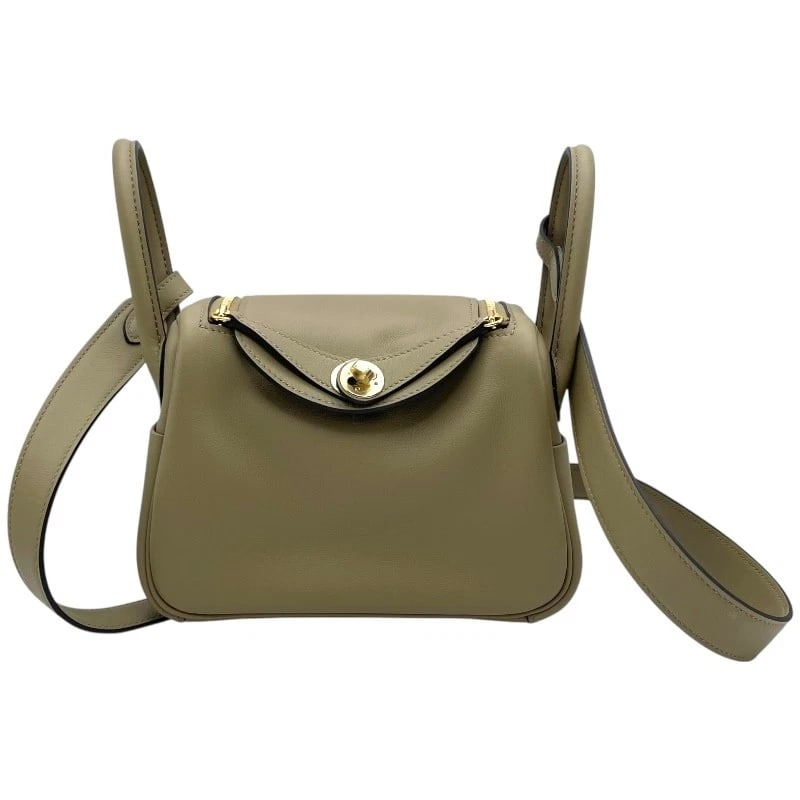 HERMES LINDIMINI VERSO SHOULDER BAG: HERMES Lindimini Verso Shoulder Bag Brand: HERMES Type: Shoulder Bag Material: Swift Color: Grimist GDHardware Size: W7.5 x H5.1x D3.5inch Shoulder:35.8inch Accessories: None Accessories N
