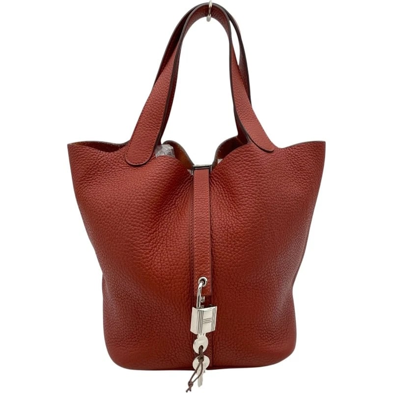HERMES PICO TAN LOCK MM HANDBAG: HERMES Pico Tan Lock MM Handbag Brand: HERMES Type: Handbag Material: Taurillon Clemence Color: Brick SVHardware Size: W8.7 x H8.7x D6.9inch Accessories: None Accessories Notice: When purc