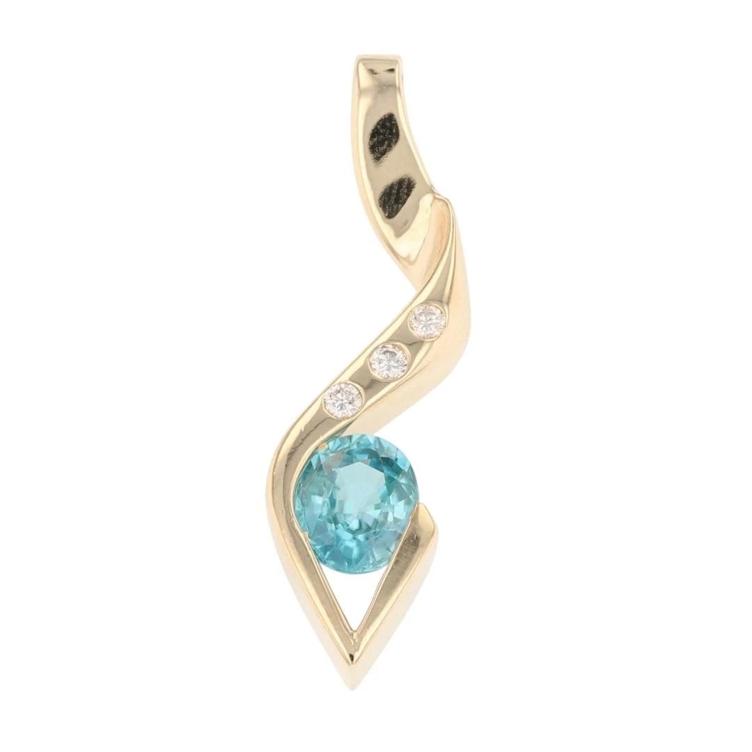 OVAL CUT BLUE ZIRCON W/ DIAMOND ACCENTS PENDANT: Oval Cut Blue Zircon w/ Diamond Accents Pendant Brand: Unbranded Type: Pendant Material: 14k Yellow Gold Main Stone/Creation Natural Color: Main Stone Color: Greenish Blue Size: Pendant Measuremen