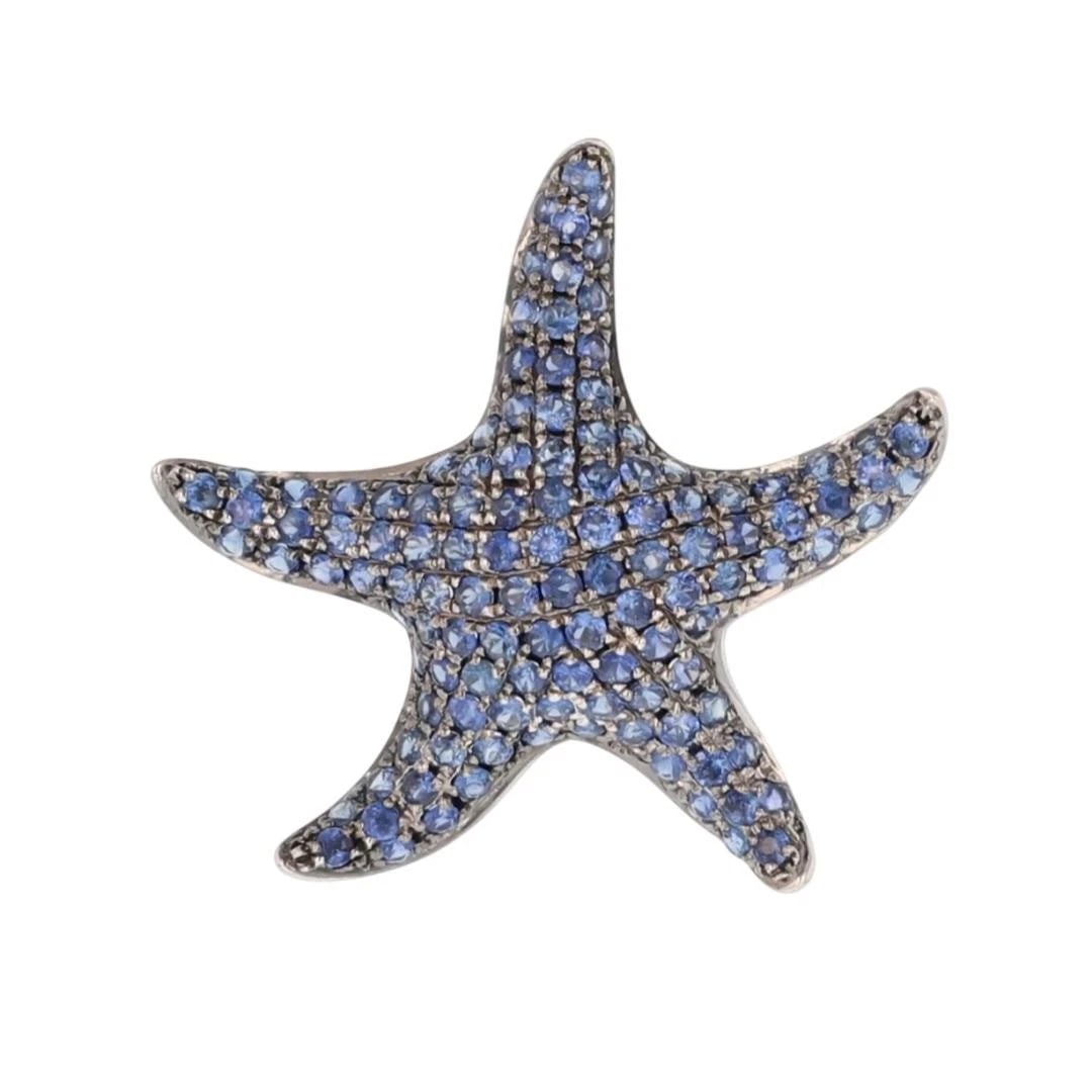 ROUND BLUE SAPPHIRE PAVÉ SET STARFISH PENDANT: Round Blue Sapphire Pavé Set Starfish Pendant Brand: Unbranded Type: Pendant Material: 18k White Gold Main Stone/Creation Natural Color: Main Stone Color: Violetish Blue Size: Pendant