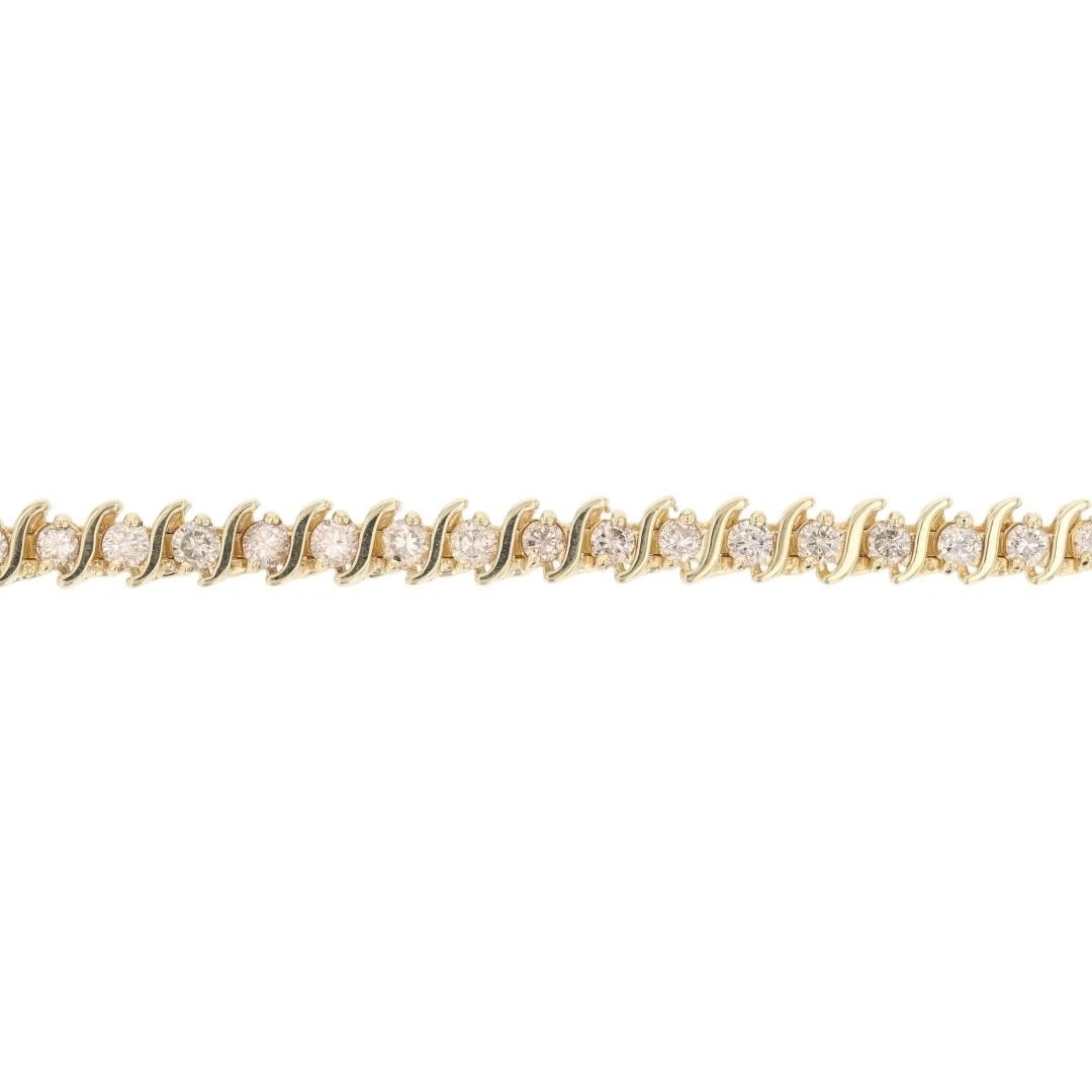 ROUND DIAMOND TENNIS BRACELET 14K YELLOW GOLD: Round Diamond Tennis Bracelet 14k Yellow Gold Brand: Unbranded Type: Bracelet Material: 14k Yellow Gold Main Stone/Creation Natural Color: None Size: Bracelet Measurement: 7.25" Length / 6.1mm