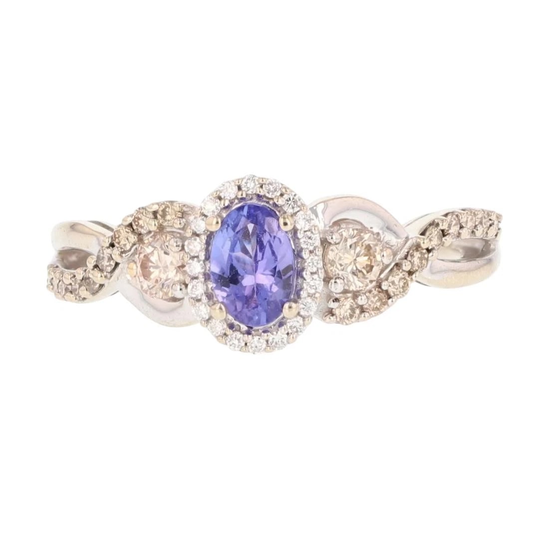 LE VIAN TANZANITE SOLITAIRE W/ DIAMOND HALO RING: Le Vian Tanzanite Solitaire w/ Diamond Halo Ring Brand: Le Vian Type: Ring Material: 14k White Gold Main Stone/Creation Tanzanite Color: Main Stone Color: Medium Light Moderately Strong Bluish