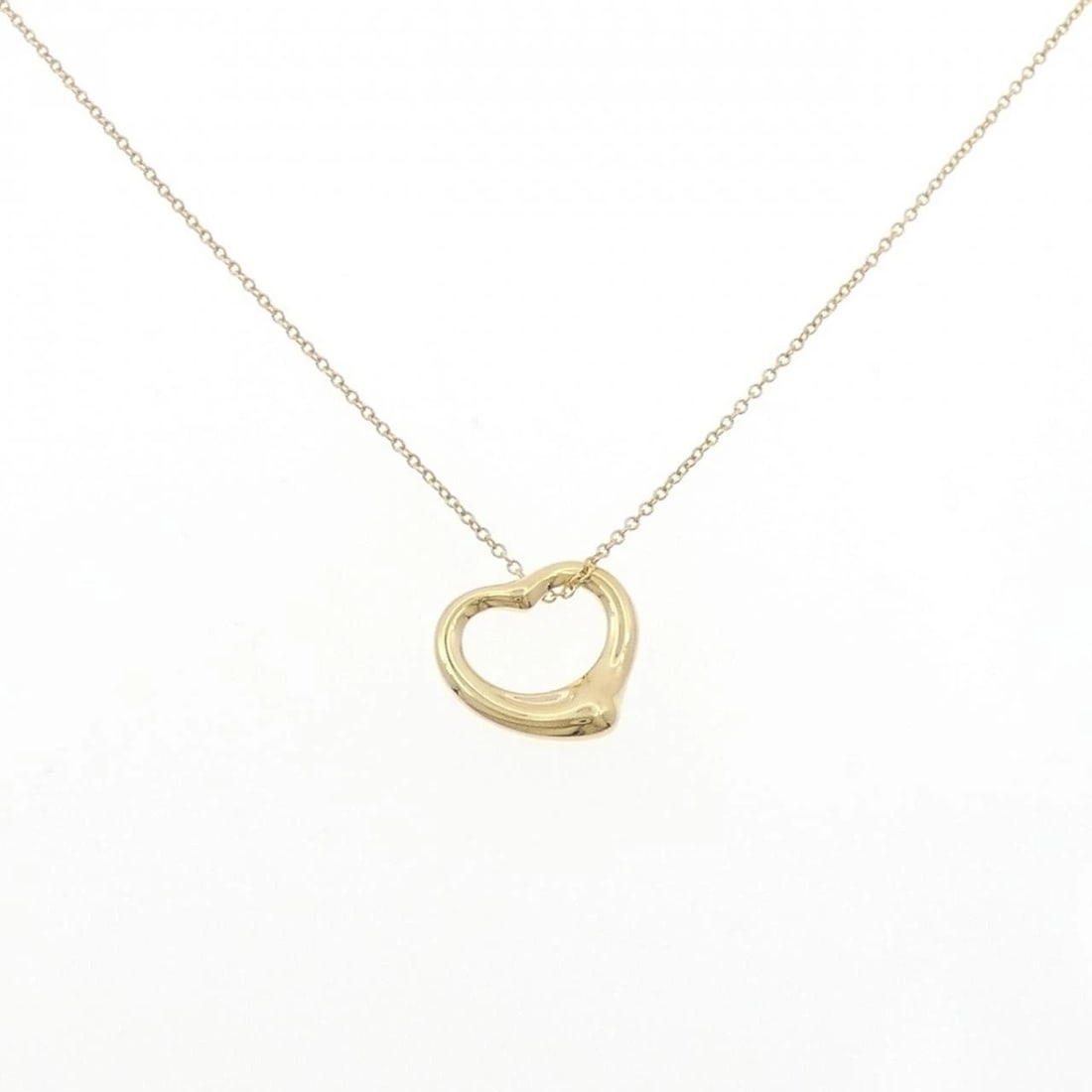 TIFFANY & CO. OPEN HEART NECKLACE: Tiffany & Co. Open Heart Necklace Brand: Tiffany Type: Necklace Material: 750 Yellow Gold Color: Yellow Gold Size: 41cm Accessories: None Accessories Notice: When purchasing pre-owned goods,