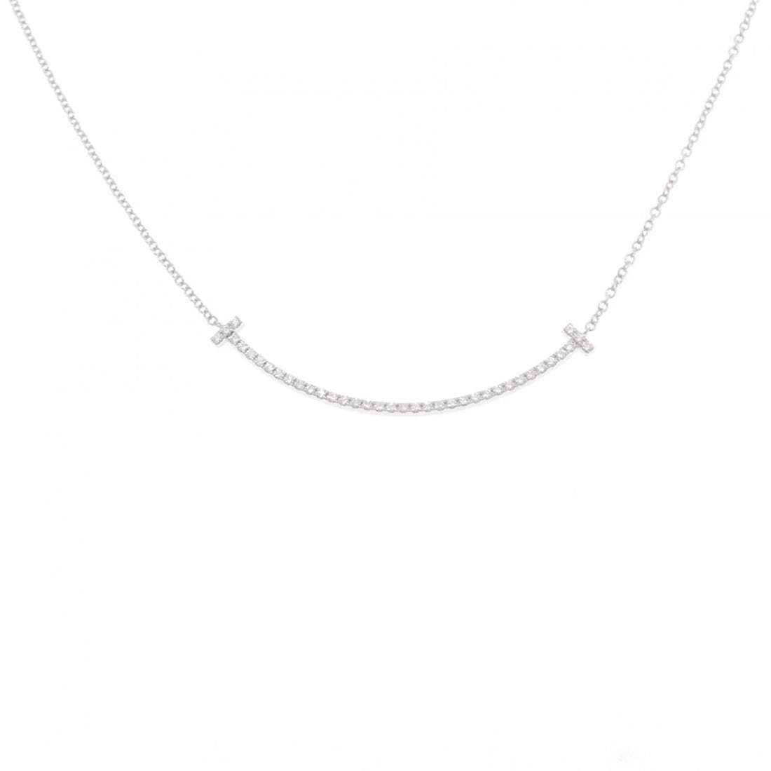 TIFFANY T SMILE SMALL NECKLACE: Tiffany T Smile Small Necklace Brand: Tiffany Type: Necklace Material: 750 White Gold Main Stone/Creation Natural Color: White Gold Size: 40cm Accessories: None Accessories Notice: When