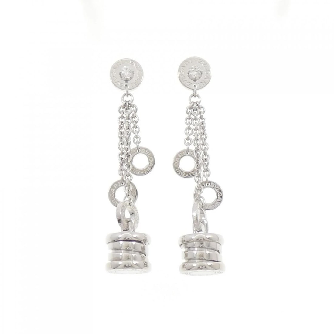 BVLGARI B.ZERO1 ELEMENT EARRINGS: BVLGARI B.zero1 Element Earrings Brand: BVLGARI Type: Earrings Material: 750 White Gold Main Stone/Creation Natural Color: White Gold Size: ActualSize HxW: 46.6mmx9.2mm Accessories: None