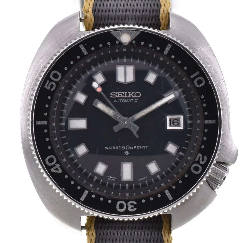 SEIKO DIVER NAOMI UEMURA WATCH: SEIKO diver Naomi Uemura Watch Brand: SEIKO Type: Wristwatch Material: Band Material Nylon, Case Material Stainless Steel Color: Dial Color black Band Color gray Case Color Silver Size: Case