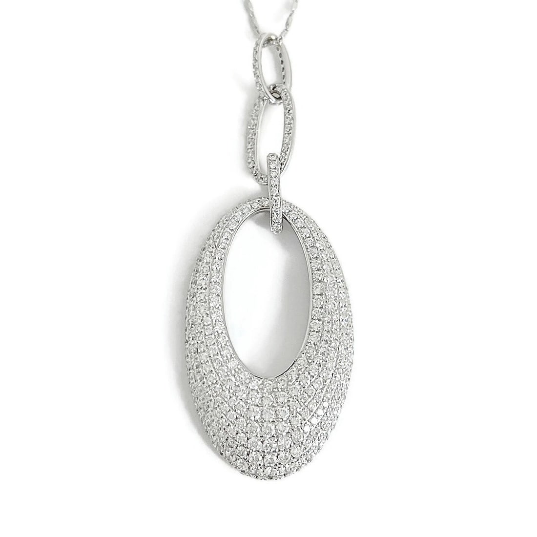 HANGING OVAL PAVE DIAMOND PENDANT NECKLACE 18K: Hanging Oval Pave Diamond Pendant Necklace 18K Brand: Unbranded Type: Necklace Material: 18K white gold (pendant); 14K white gold (chain) Main Stone/Creation Natural Color: Silver Size: Length: 18