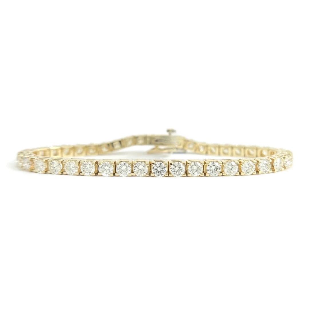 ROUND DIAMOND TENNIS BRACELET 14K YELLOW GOLD: Round Diamond Tennis Bracelet 14K Yellow Gold Brand: Unbranded Type: Bracelet Material: 14K Yellow Gold Main Stone/Creation Natural Color: Yellow Size: Length: 7.25 inches Width: 3.8 mm Accessori