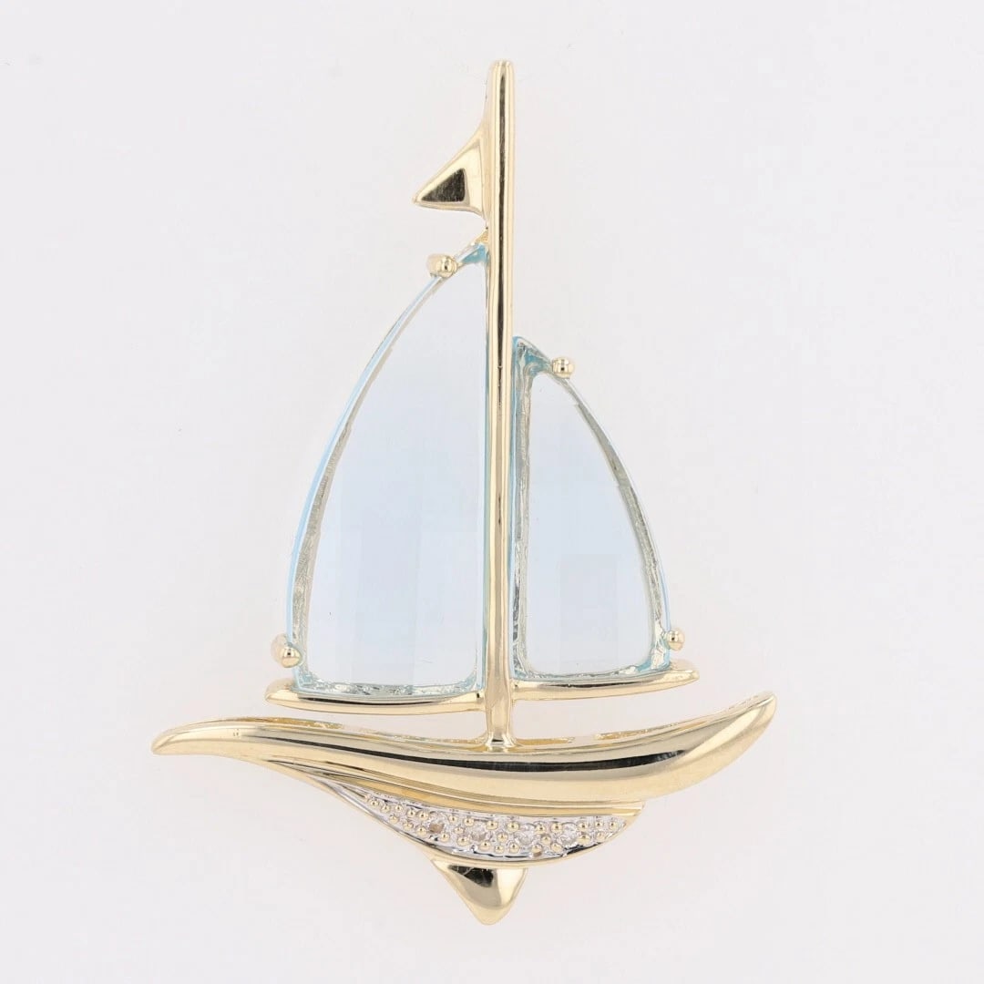 FANCY BLUE TOPAZ & DIAMOND SAILBOAT PENDANT: Fancy Blue Topaz & Diamond Sailboat Pendant Brand: Unbranded Type: Pendant Material: 14k Yellow Gold Main Stone/Creation Natural Color: Main Stone: Blue Topaz Size: Pendant Measurement: 42.5mm Len