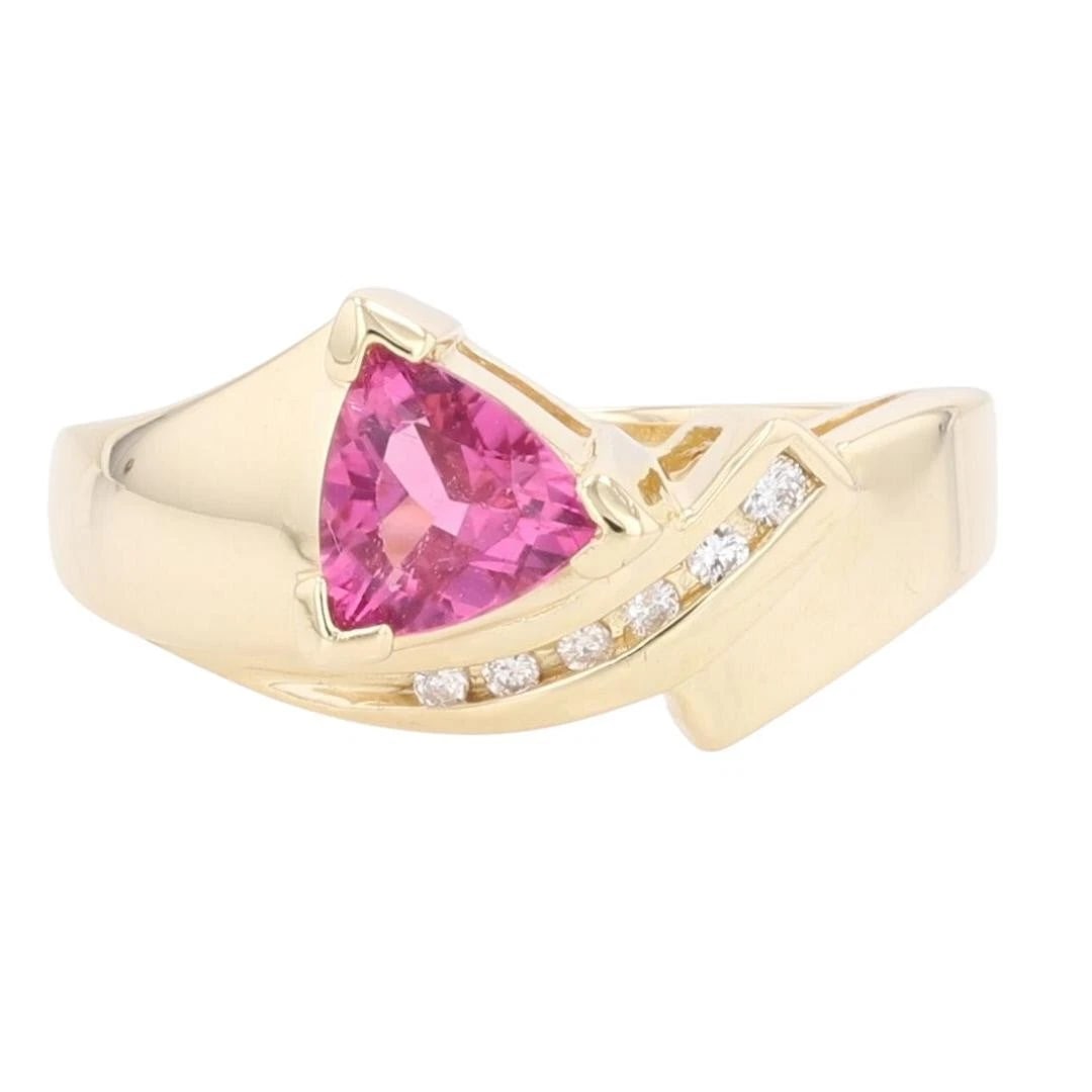 TRILLION CUT PINK TOURMALINE AND DIAMOND RING: Trillion Cut Pink Tourmaline and Diamond Ring Brand: Unbranded Type: Ring Material: 14k Yellow Gold Main Stone/Creation Tourmaline Color: Main Stone Color: Medium Moderately Strong Purple Red 