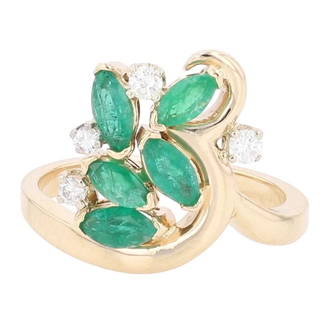 MARQUISE CUT EMERALD AND DIAMOND CLUSTER RING: Marquise Cut Emerald and Diamond Cluster Ring Brand: Unbranded Type: Ring Material: 14k Yellow Gold Main Stone/Creation Emerald Color: Main Stone Color: Medium Dark Moderately Strong Bluish