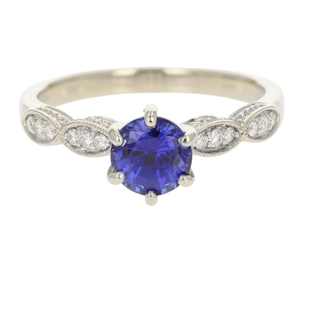 LAB-CREATED SAPPHIRE WITH DIAMOND ACCENTS RING: Lab-Created Sapphire with Diamond Accents Ring Brand: Unbranded Type: Ring Material: 14k White Gold Main Stone/Creation Sapphire Color: Main Stone Color: Medium Dark Vivid Blue Size: 7 US Accesso
