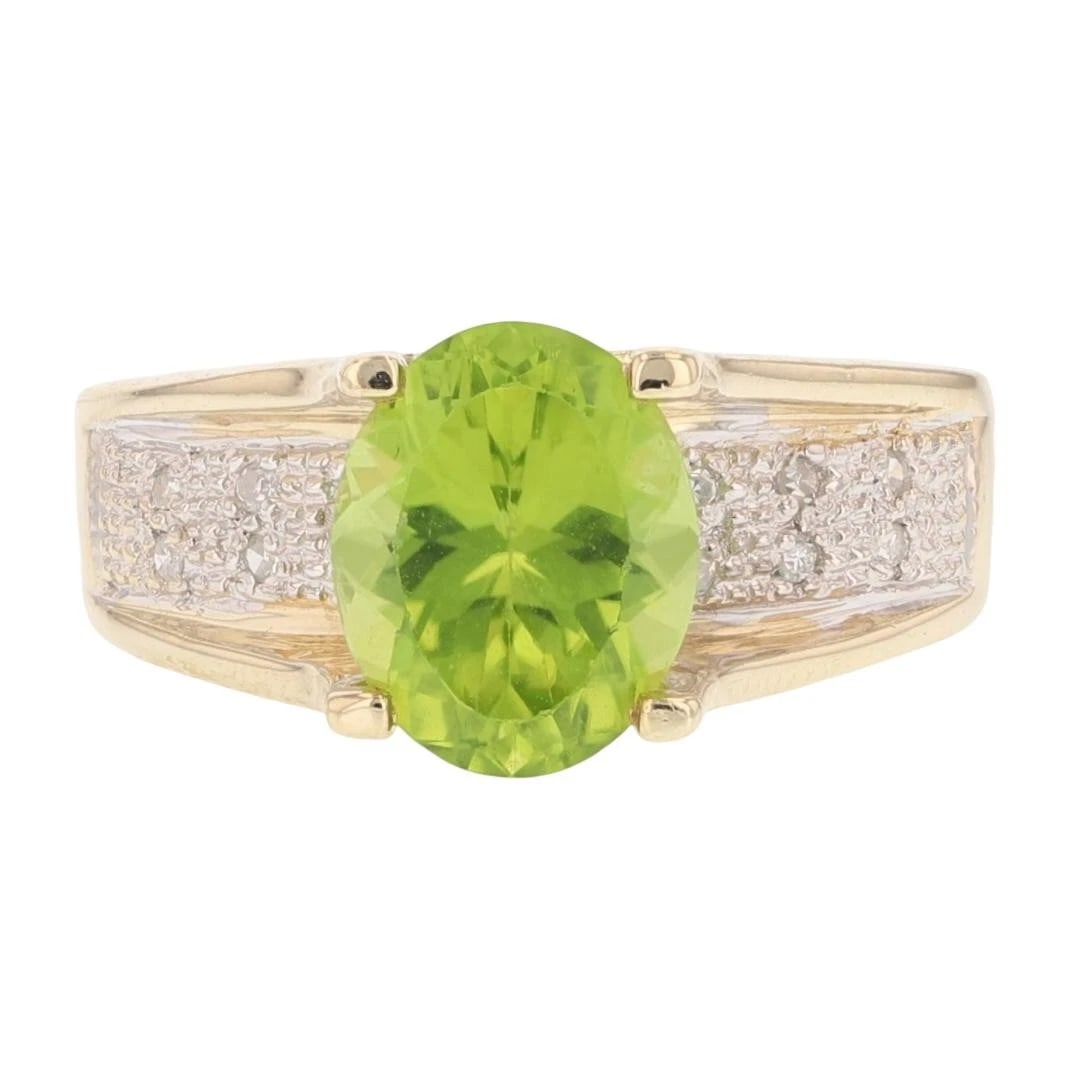OVAL PERIDOT SOLITAIRE W/ DIAMOND ACCENTS RING: Oval Peridot Solitaire w/ Diamond Accents Ring Brand: Unbranded Type: Ring Material: 10k Yellow Gold Main Stone/Creation Natural Color: Main Stone Color: Yellowish Green Size: 7.25 US 