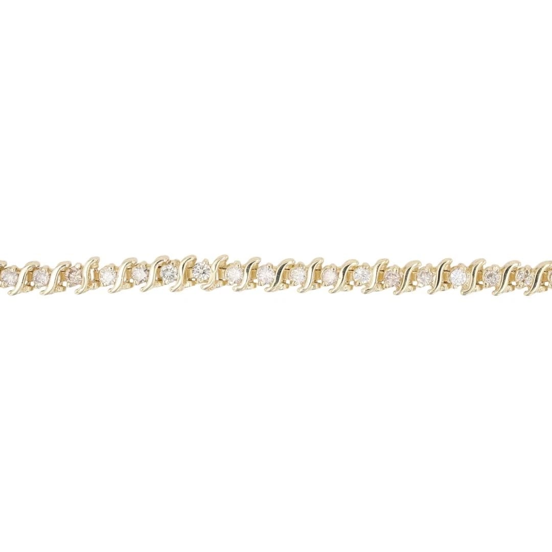 ROUND DIAMOND S-LINK TENNIS BRACELET 14K YELLOW GOLD: Round Diamond S-Link Tennis Bracelet 14k Yellow Gold Brand: Unbranded Type: Bracelet Material: 14k Yellow Gold Main Stone/Creation Natural Color: None Size: Bracelet Measurement: 6.75" Length
