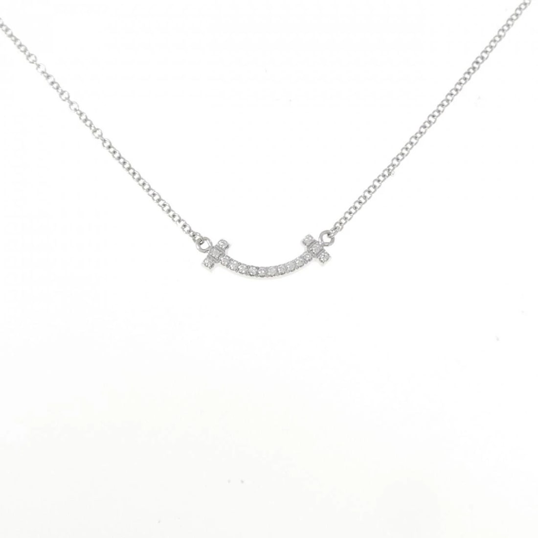 TIFFANY T SMILE MINI NECKLACE: Tiffany T Smile mini Necklace Brand: Tiffany Type: Necklace Material: 750 White Gold Main Stone/Creation Natural Color: White Gold Size: 41/46cm Accessories: None Accessories Notice: When