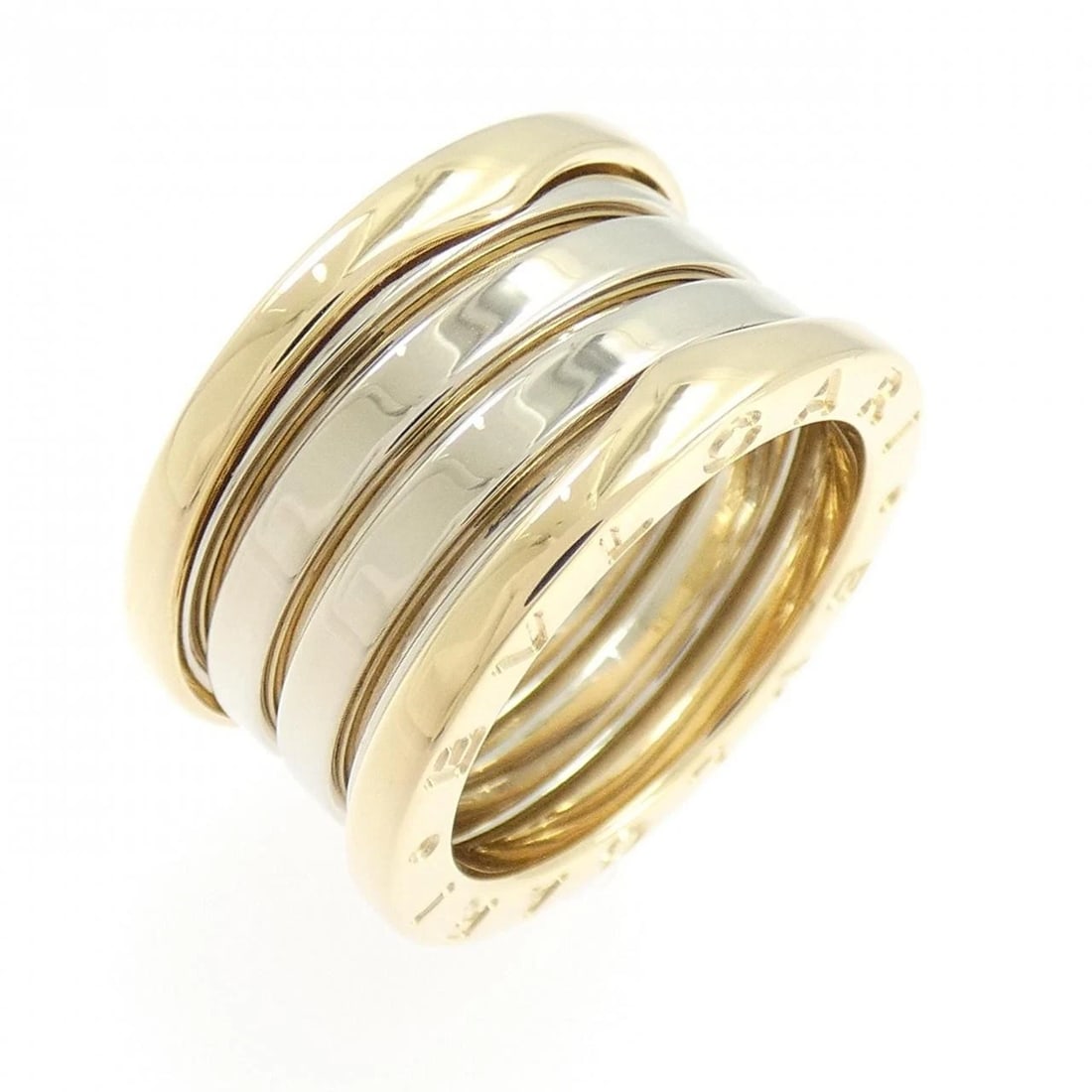 BVLGARI B.ZERO1 RING: BVLGARI B.zero1 Ring Brand: BVLGARI Type: Ring Material: 750 Yellow Gold 750 White Gold Color: Yellow Gold White Gold Size: 5-5.5 (US size) (50) Accessories: None Accessories Notice: When