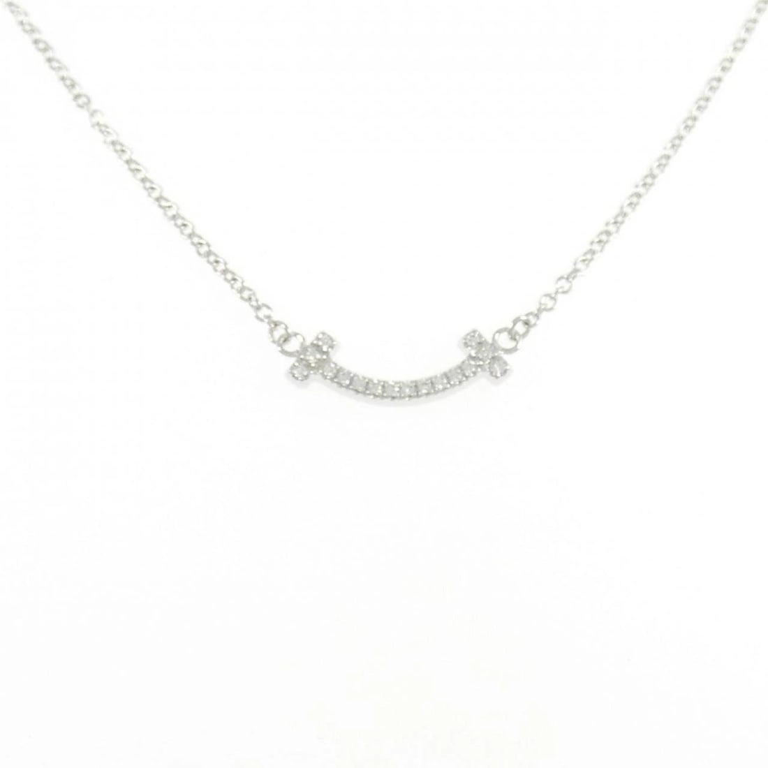 TIFFANY T SMILE MINI NECKLACE: Tiffany T Smile mini Necklace Brand: Tiffany Type: Necklace Material: 750 White Gold Main Stone/Creation Natural Color: White Gold Size: 36cm Accessories: None Accessories Notice: When