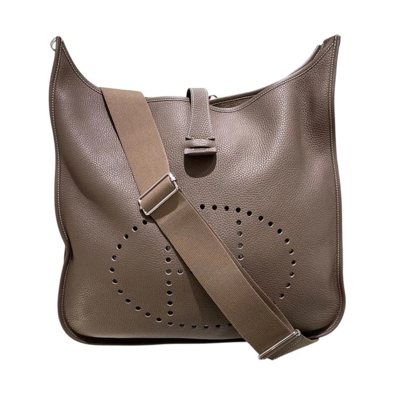 HERMES EVELYNE STAMP ETOUPE CLEMENCE LEATHER SHOULDER BAG: HERMES Evelyne Stamp Etoupe Clemence Leather Shoulder Bag Brand: HERMES Type/Style: Handbag Material: Taurillon Color: Etoupe/SV Hardware Size: W: 36cm / H: 39cm / D: 10cm Accessories: None