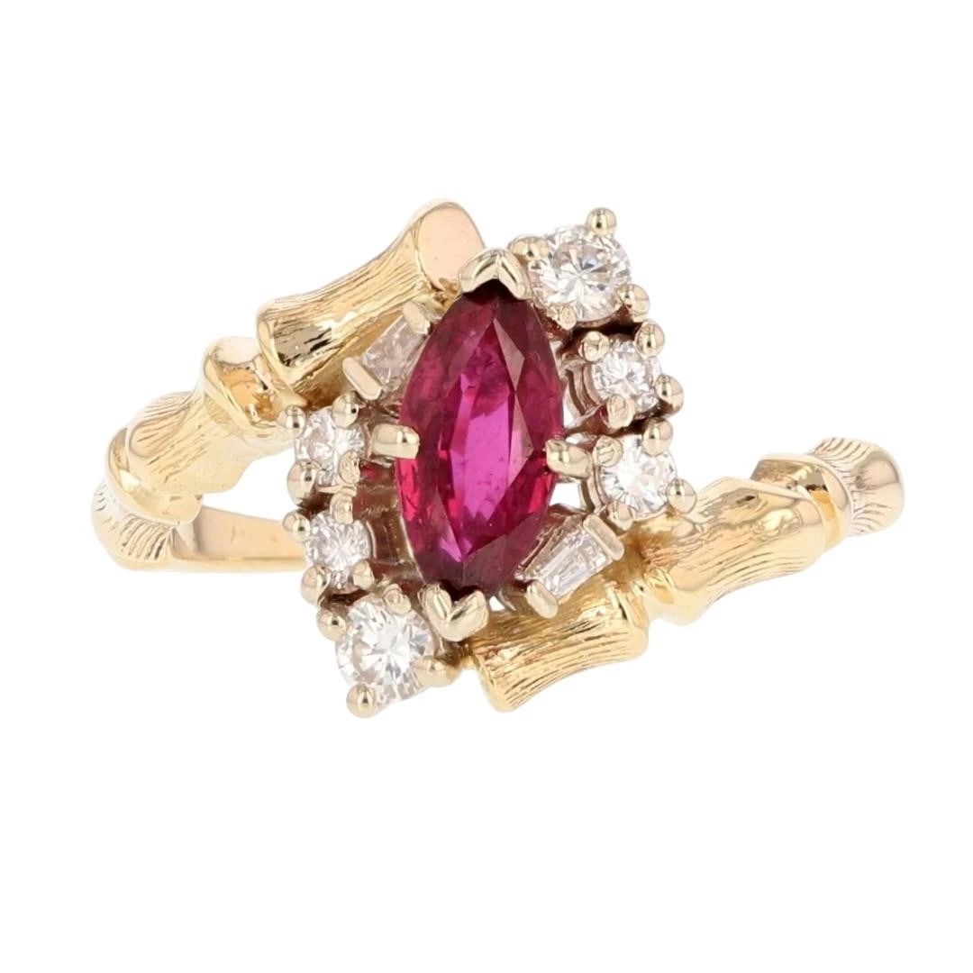 RUBY W/ DIAMOND HALO BYPASS BAMBOO SHANK RING: Ruby w/ Diamond Halo Bypass Bamboo Shank Ring Brand: Unbranded Type: Ring Material: 14k Yellow Gold Main Stone/Creation Ruby Color: Main Stone Color: Medium Dark Moderately Strong Slightly Purplish
