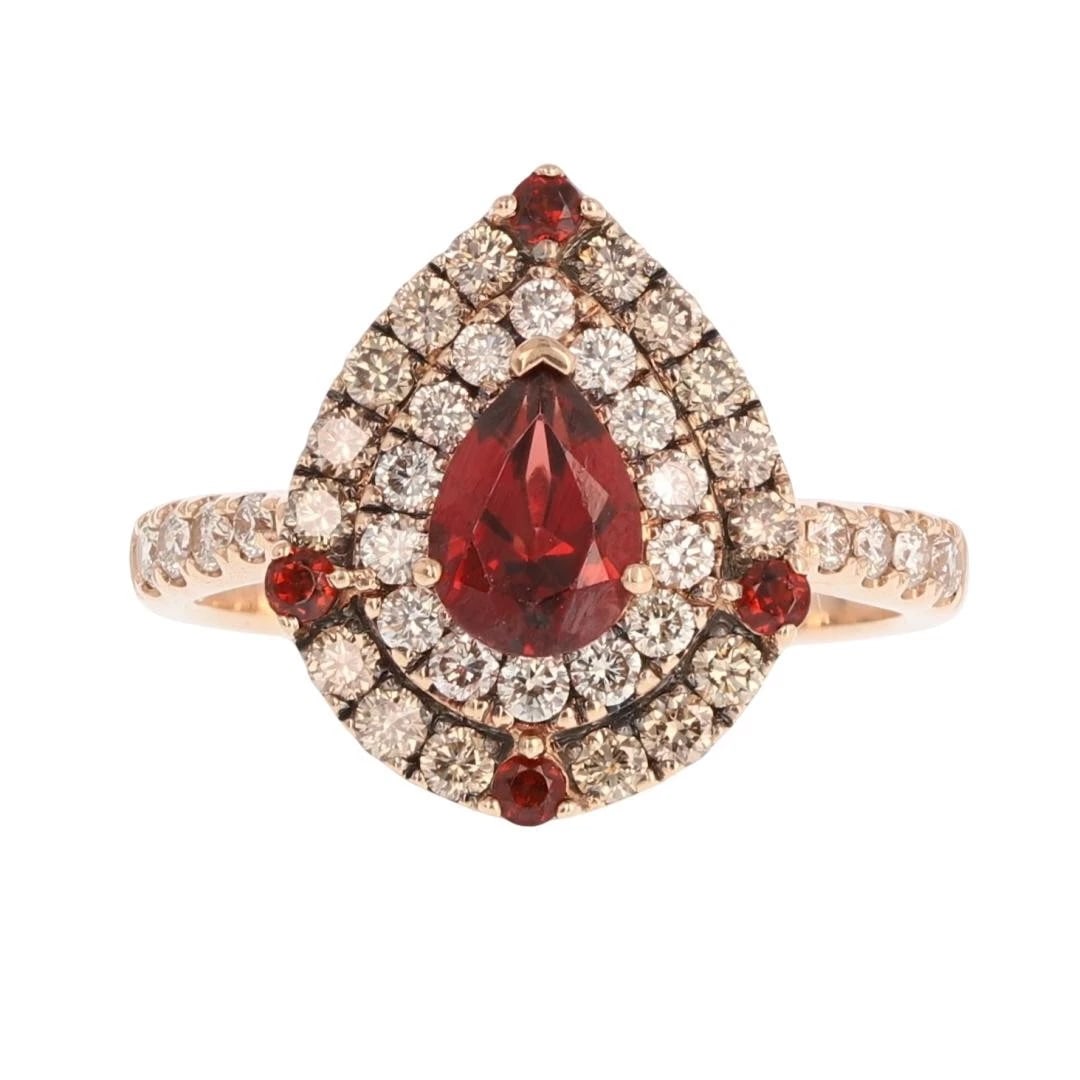 LE VIAN PEAR GARNET W/ DIAMOND DOUBLE HALO RING: Le Vian Pear Garnet w/ Diamond Double Halo Ring Brand: Le Vian Type: Ring Material: 14k Rose Gold Main Stone/Creation Garnet Color: Main Stone Color: Dark Moderately Strong Slightly Purplish