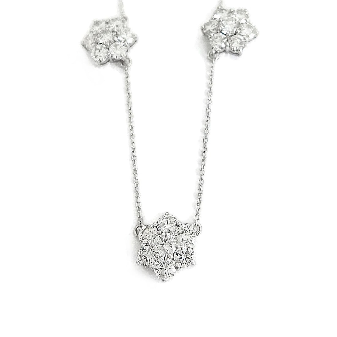 FLOWER DIAMOND CLUSTER STATION NECKLACE 14K: Flower Diamond Cluster Station Necklace 14K Brand: Unbranded Type: Necklace Material: 14K White Gold Main Stone/Creation Natural Color: Silver Size: Length: 16 inches Width: 11 mm at clusters Acc