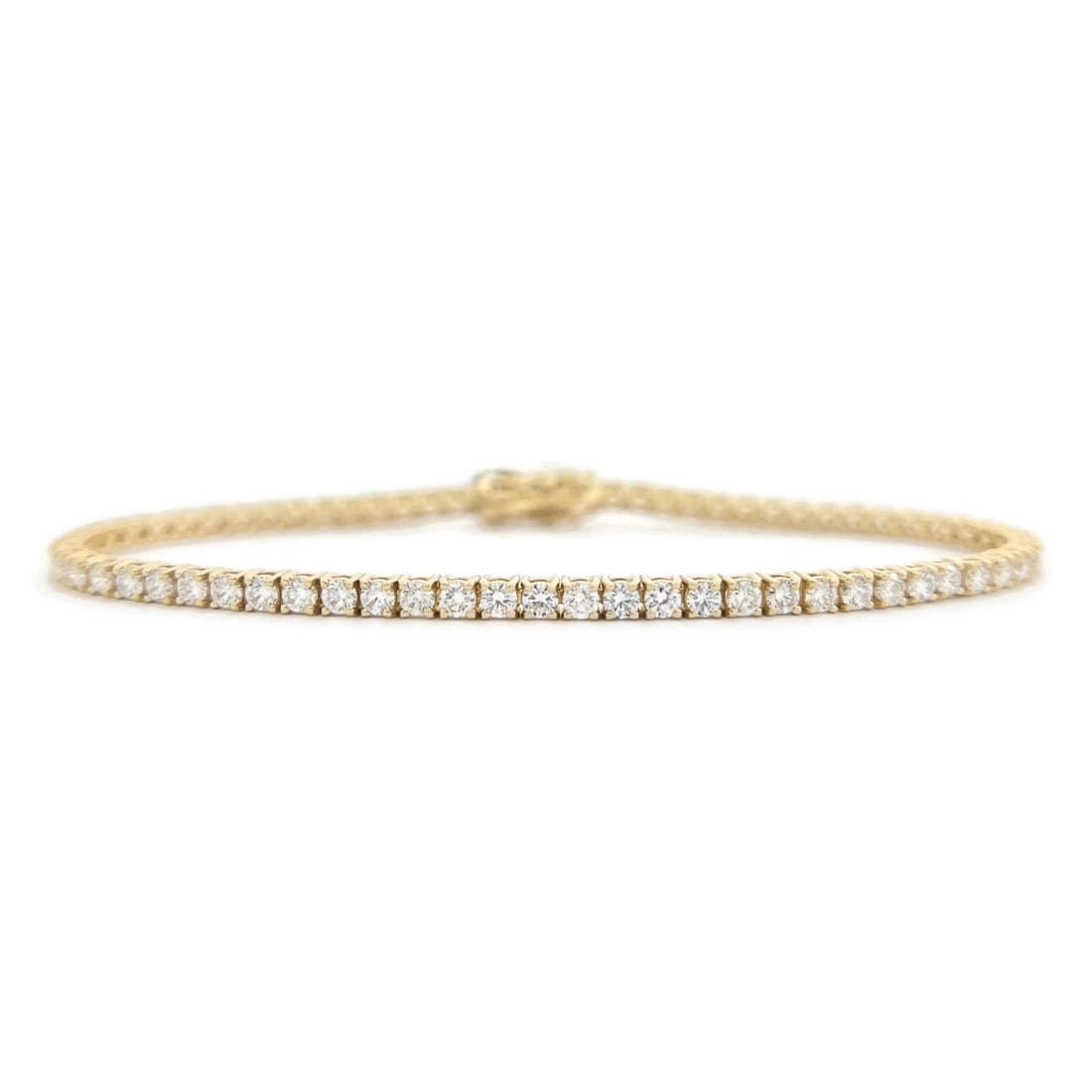 ROUND DIAMOND TENNIS BRACELET 14K YELLOW GOLD: Round Diamond Tennis Bracelet 14K Yellow Gold Brand: Salvatore & Co. Type: Bracelet Material: 14K Yellow Gold Main Stone/Creation Natural Color: Gold Size: Length: 7 inches Width: 2.6 mm Accessor
